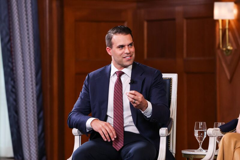 Socrates in the City Bonhoeffer roundtable: panelist in a red tie speaking